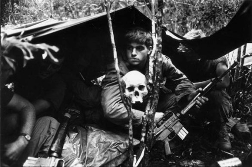 A human skull keeps watch over US soldiers encamped in the Vietnamese jungle during the Vietnam War.   (Photo by Terry Fincher/Getty Images)